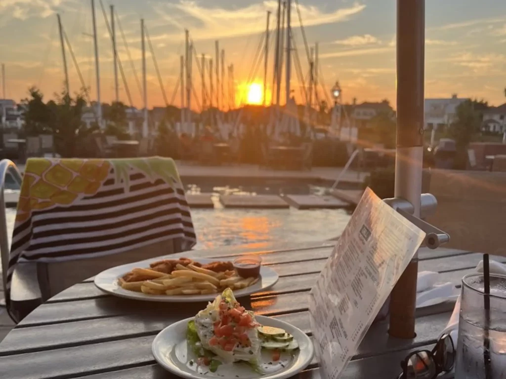 Couple having dinner by Lake Atitlan at a mid-range restaurant, showing typical food costs and Lake Atitlan daily budget
