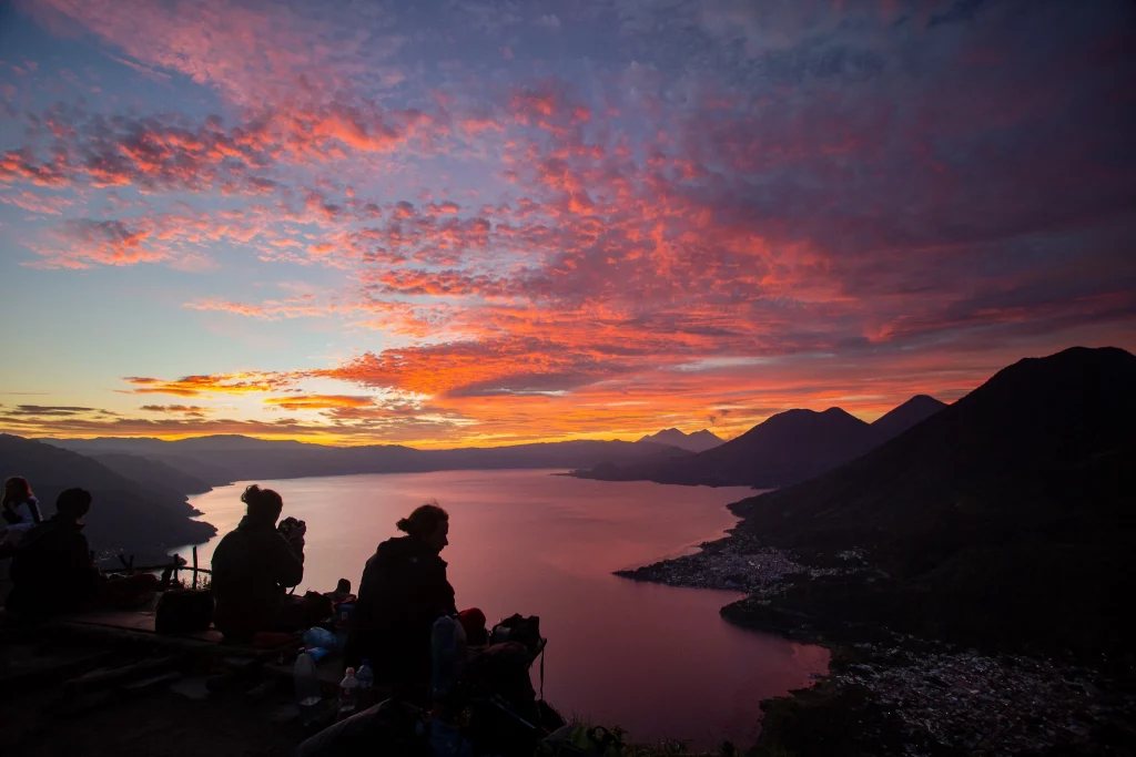 Carpe Diem students planting tul along lake shore