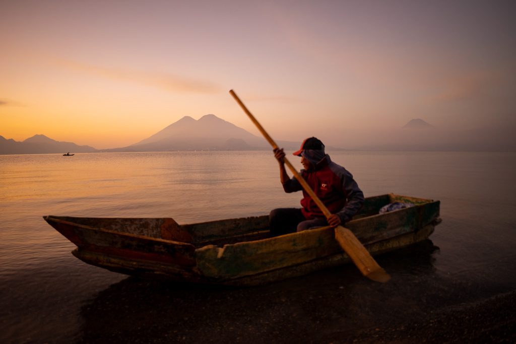 Kayaking across Lake Atitlán as part of a planned adventure itinerary