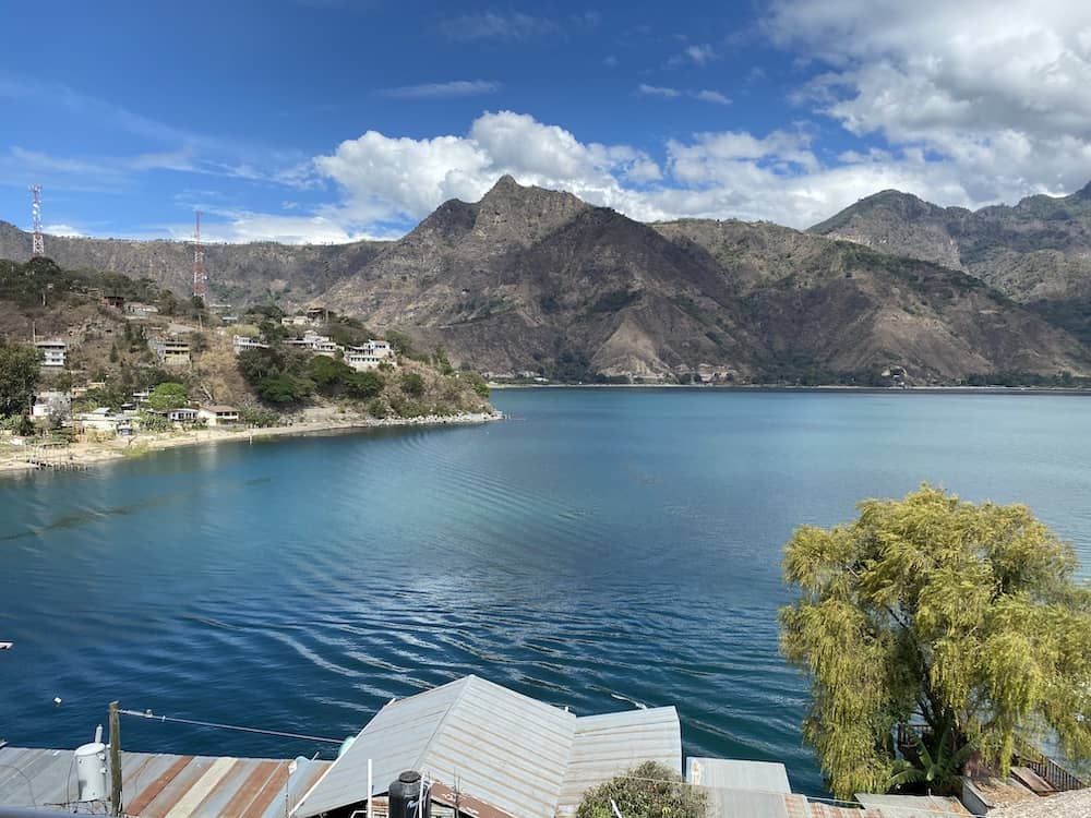 Lake Atitlán Guatemala with clear volcano views and sunny dry-season weather