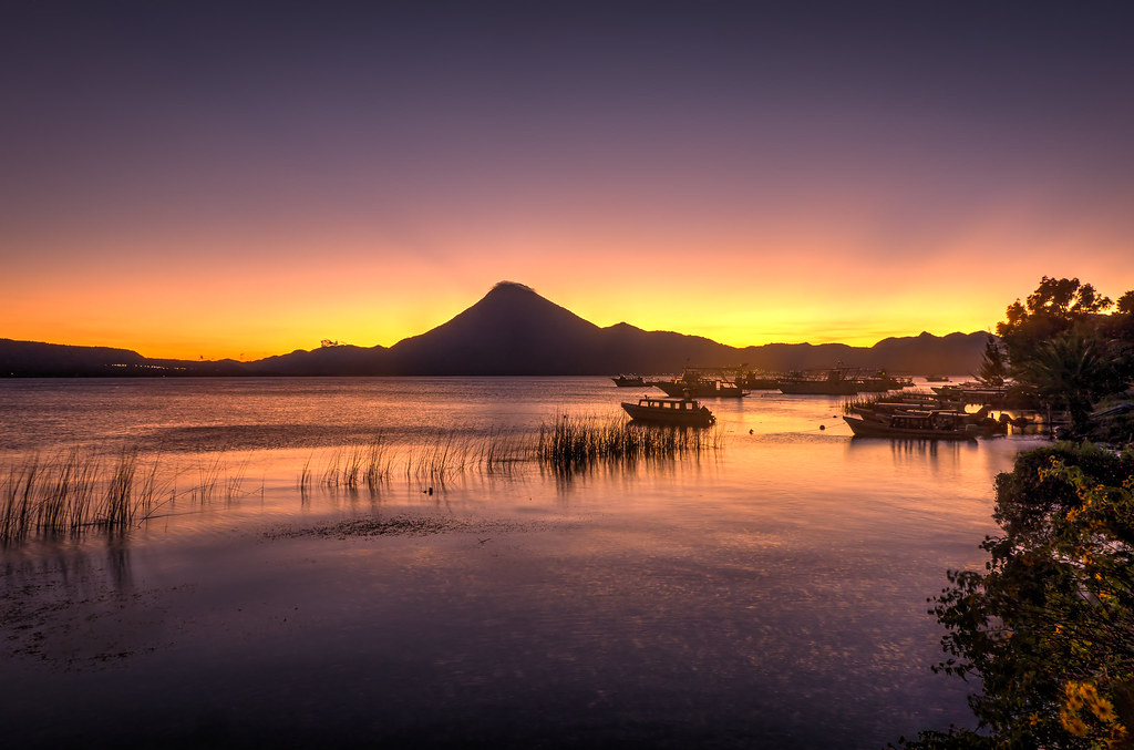Sunrise over Lake Atitlán, ideal for concluding a multi-day adventure itinerary