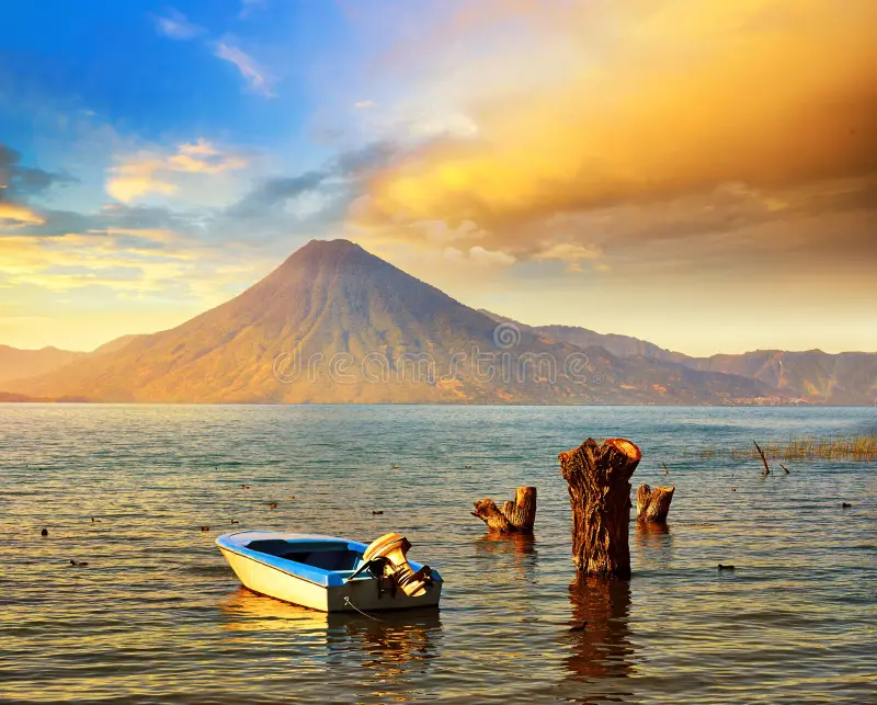 Sunset view over Lake Atitlán with volcanoes in the background