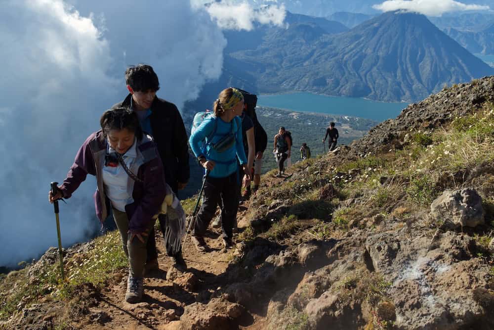 Volcano hiking at Lake Atitlán with clear summit visibility during dry season